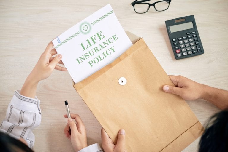 Crop people with contract of life insurance